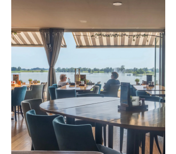 Verblijf in een TOP hotel + HEERLIJK TERRAS aan de Maas in de prachtige natuur bij Nijmegen